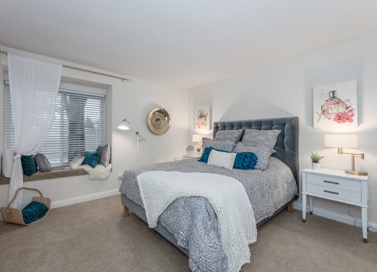 Bedroom with cozy bed at Harpers Point Apartments, Cincinnati, Ohio