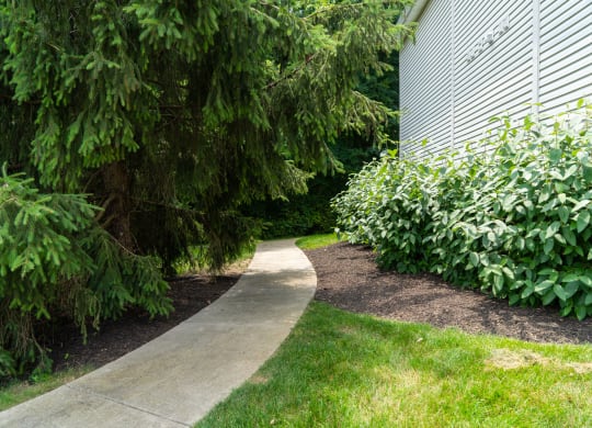 Sdewalk in a garden next to a building at Honey Creek, Greenwood, IN