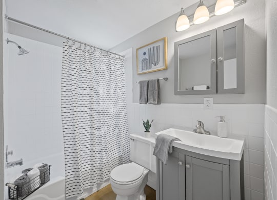 a bathroom with a shower and a sink and a toilet at Huntley Ridge, Ohio, 45419