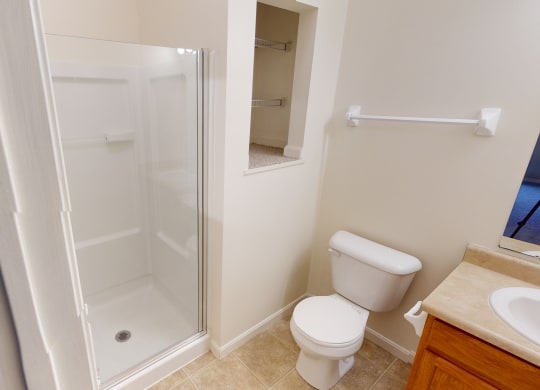 a small bathroom with a shower and a toilet