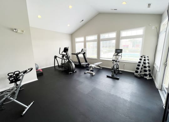 the gym is fully equipped with cardio equipment and weights at Traditions at Slate Ridge, Ohio, 43068