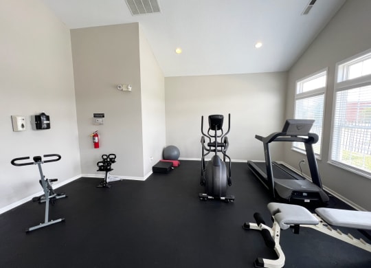 a gym with treadmills and other exercise equipment in a building at Traditions at Slate Ridge, Reynoldsburg