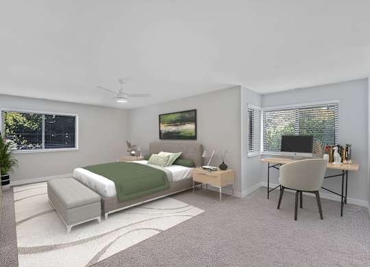 A bedroom with a bed, desk, and chair. at Indian Creek Apartments*, Cincinnati, Ohio
