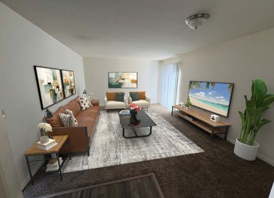 A living room with a brown couch, a coffee table, and a flat screen TV.