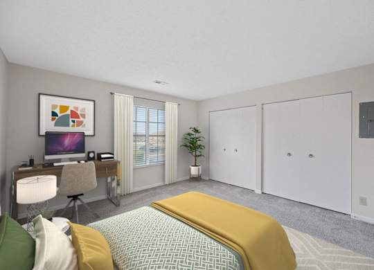 a bedroom with a bed and a desk and a tv at Normandy Club Apartments, Ohio