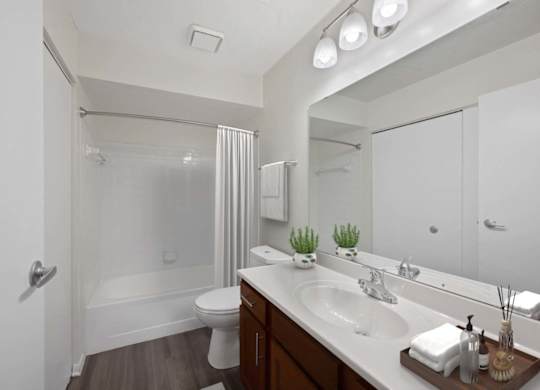a bathroom with a sink and a shower and a toilet at Normandy Club Apartments, Centerville, 45459
