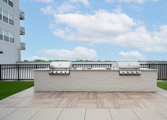 a barbecue grill on the roof of a building