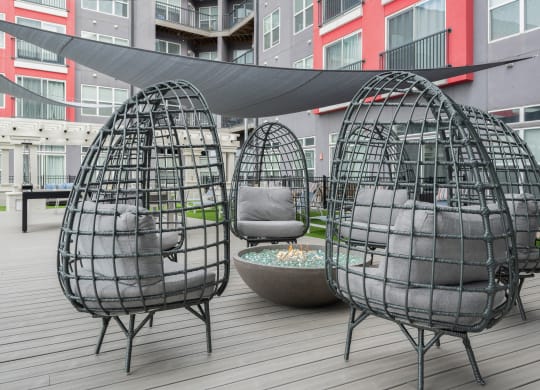a set of three geodesic egg chairs on a patio