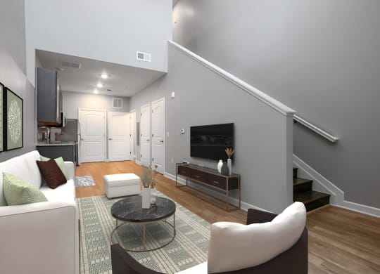 a living room with a couch and a table and a television at Adelphi Quarter, Columbus, Ohio