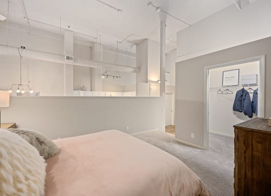 Bedroom with cozy bed at The Lofts at Shillito Place, Ohio
