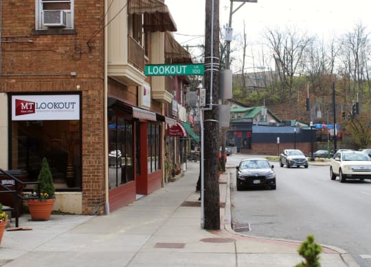 a city street with cars driving down it