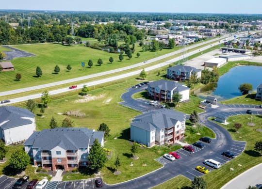 an aerial view of a neighborhood with houses and a parking lot