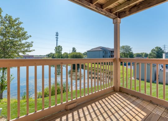 the view from the deck of a house overlooking the water