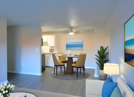 a living room and dining room with a table and chairs