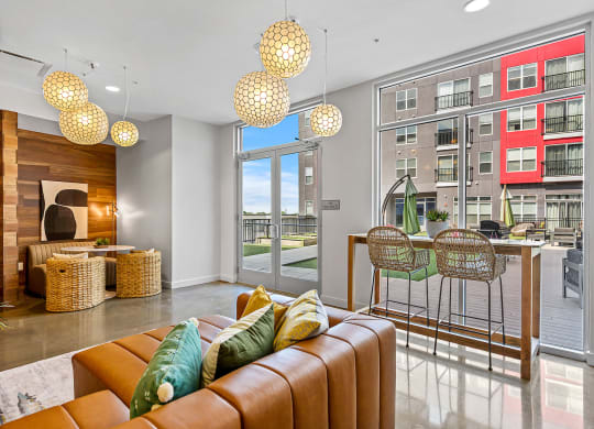 a living room with a couch and a table with chairs
