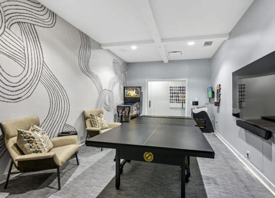 Dog-Friendly Apartments in West Chester, OH- Liberty Center- Gameroom with Ping Pong Tabe, Arcade Games and Grey Carpeting