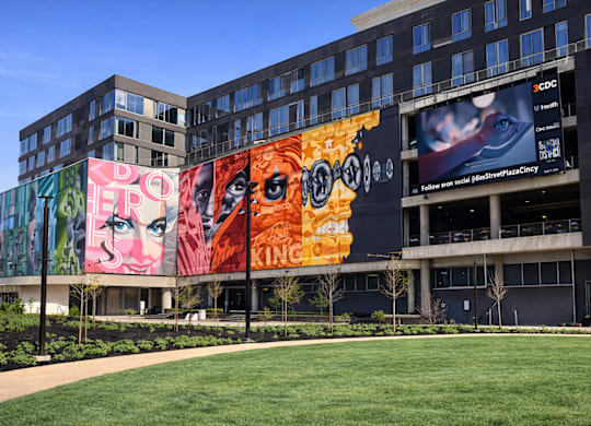 A building with a large mural on its side.