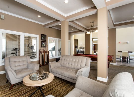 a living room with couches and a coffee table