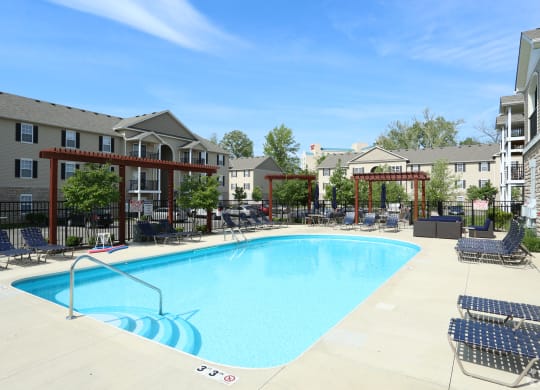 our resort style swimming pool is surrounded by our apartments and has lounge chairs