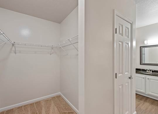 an empty bedroom with a closet and a bathroom at Roebling Row, Kentucky