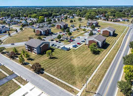 A suburban neighborhood with houses and a road.