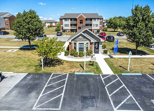 A parking lot with a building in the background.
