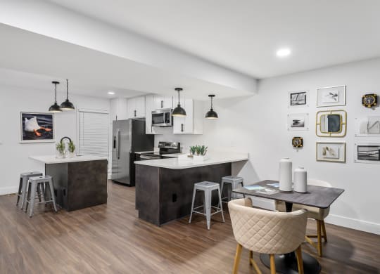 a kitchen and dining area in a 555 waverly unit