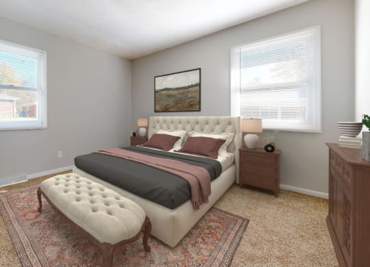 a bedroom with a bed and two windows at Stonebrook of Franklin, Franklin, 46131