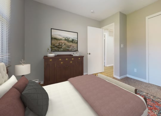 a bedroom with a bed and a dresser and a door to a hallway at Stonebrook of Franklin, Franklin, 46131