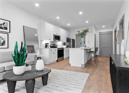 A modern kitchen with a dining area and a living room. at The Ridge Apartments, Ohio, 45213