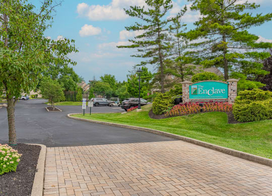 a view of the entrance sign at the enclave at woodbridge apartments in sugar land, tx at Enclave, Beavercreek, 45431