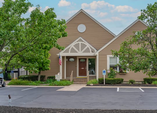 a large brown building with trees in front of it at Enclave, Beavercreek, Ohio