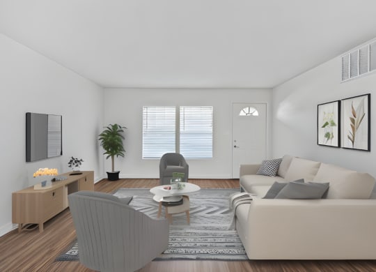 a living room with a couch and a chair and a table