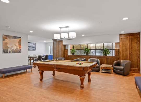 Game room with a pool table and chairs at The Valley, Cincinnati, Ohio