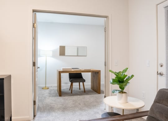 a bedroom with a desk and chair in a 555 waverly unit at Waterstone Landing, Perrysburg, OH