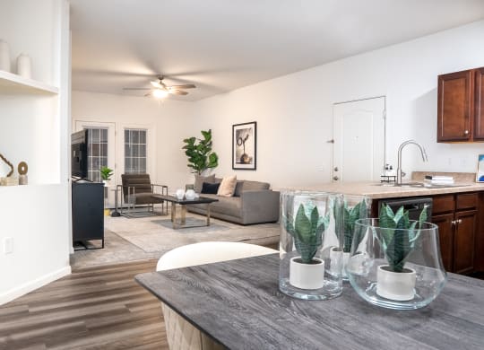 a living room and kitchen area with white walls and wood flooring at Waterstone Landing, Ohio, 43551