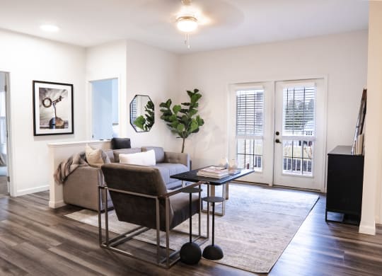 a living room with white walls and hardwood flooring  at Waterstone Landing, Ohio