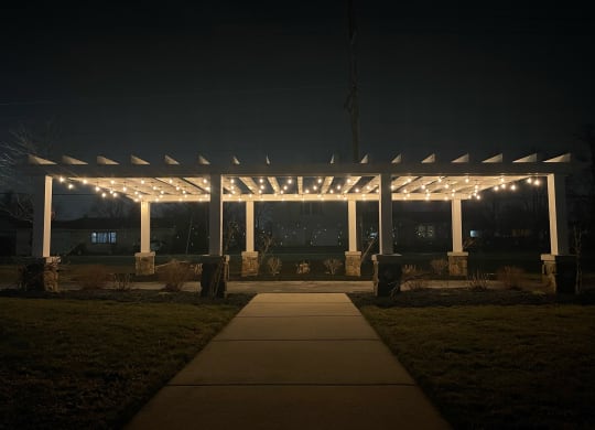 a pergola with string lights at night  at Waterstone Landing, Ohio, 43551