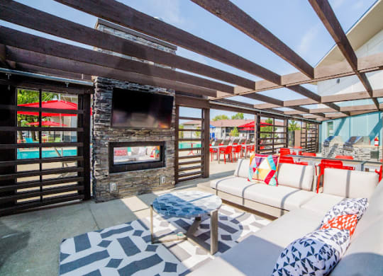 a patio with couches and a fireplace at 7 Pointe Apartments, Indianapolis