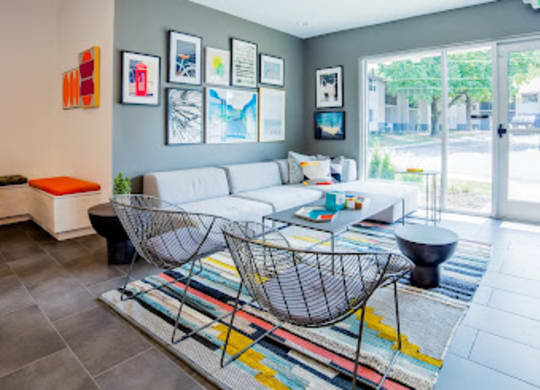 a living room filled with furniture and a large window at 7 Pointe Apartments, Indiana