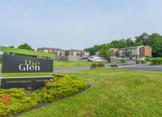 a sign for the glen at the entrance to a subdivision with houses at The Woodridge Collection, Ohio