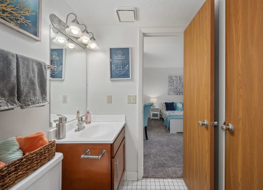 a bathroom with a sink and a mirror at The Woodridge Collection, Fairfield, 45014