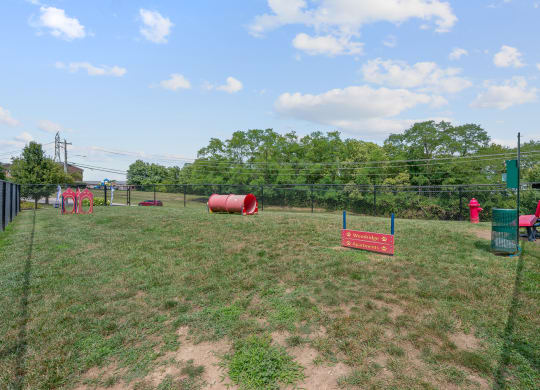 a fenced in dog park with agility courses at The Woodridge Collection, Fairfield