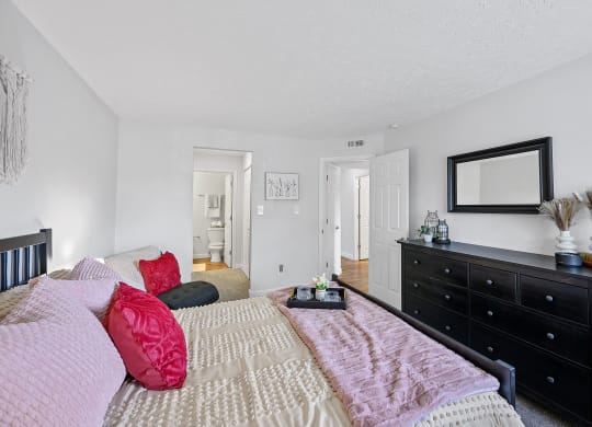 Bedroom with a bed and a dresser and a mirror at Wrights Point, Ft Wright, KY