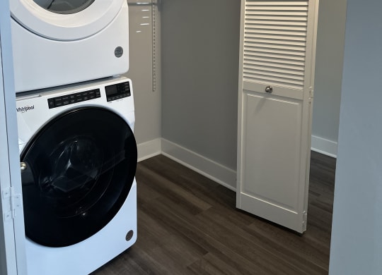 a washer and dryer in a laundry room with a closet