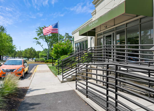 the front of a building with a car parked outside