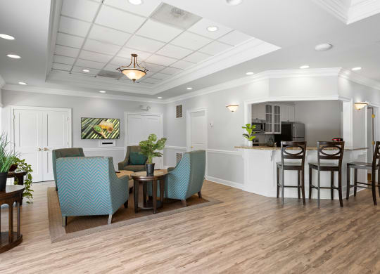 a living room with a dining area and a kitchen