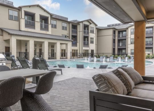 Resort-Style Pool with Grilling Area, Tanning Ledges, Cabanas & Hot Tub at The Bridge at McKinney