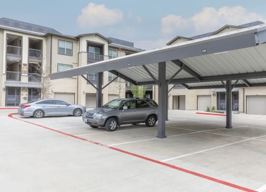 a carport with awning in a parking lot