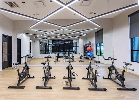 the gym has a large amount of exercise bikesat Sterling Nashville West Apartments, Tennessee